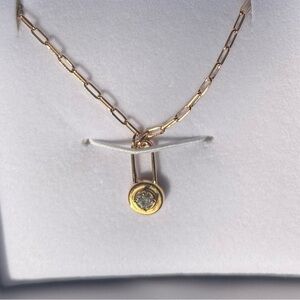 Oak and Luna 
LOCK & LUNA CHARM WITH ROUND CUT DIAMOND- GOLD VERMEIL